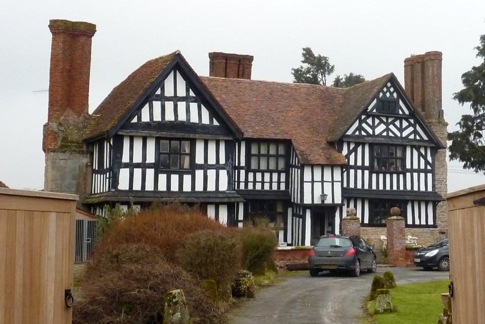 A black and white timber framed house with brick chimneys in Worcestershire